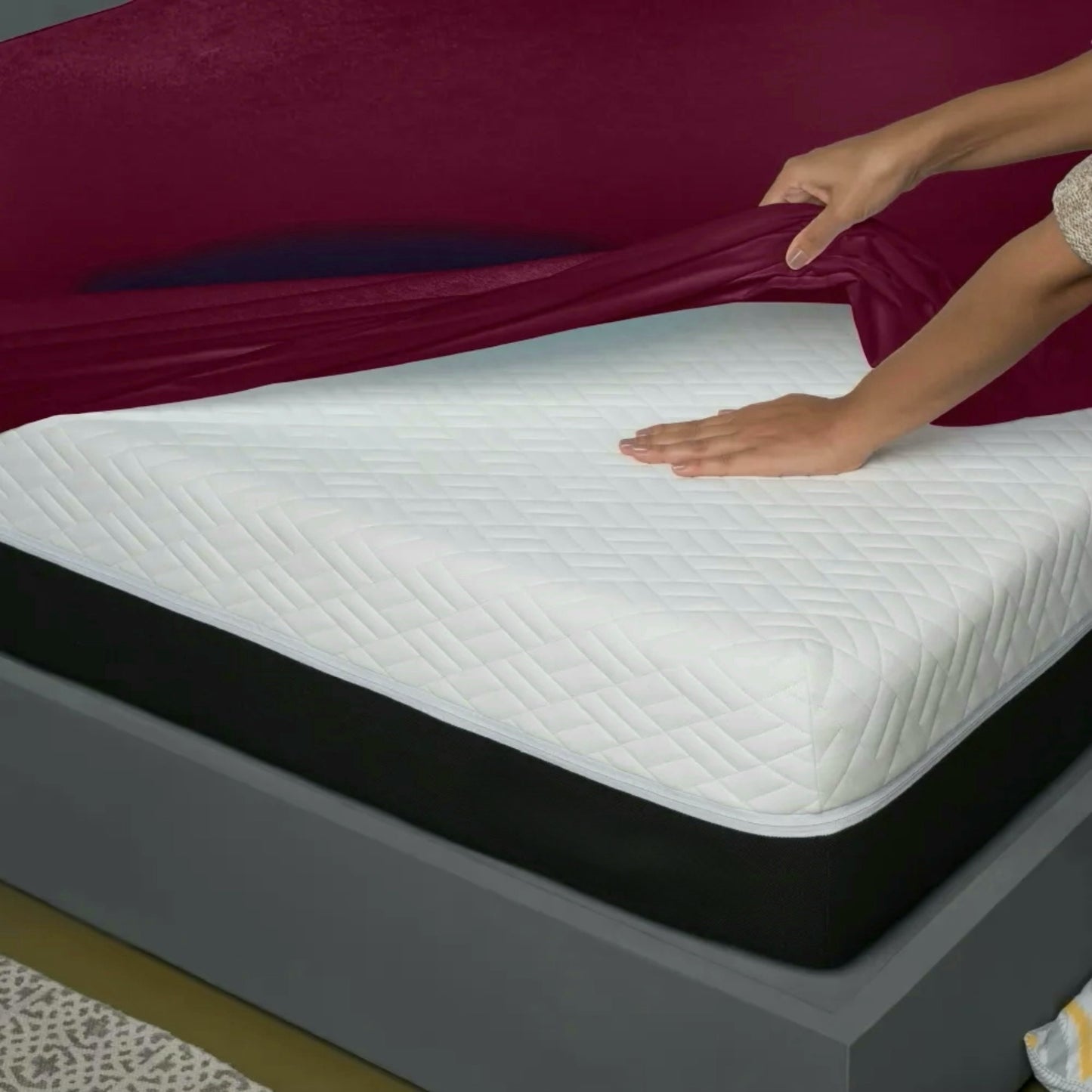 Uchuu's waterproof mattress cover in maroon color.