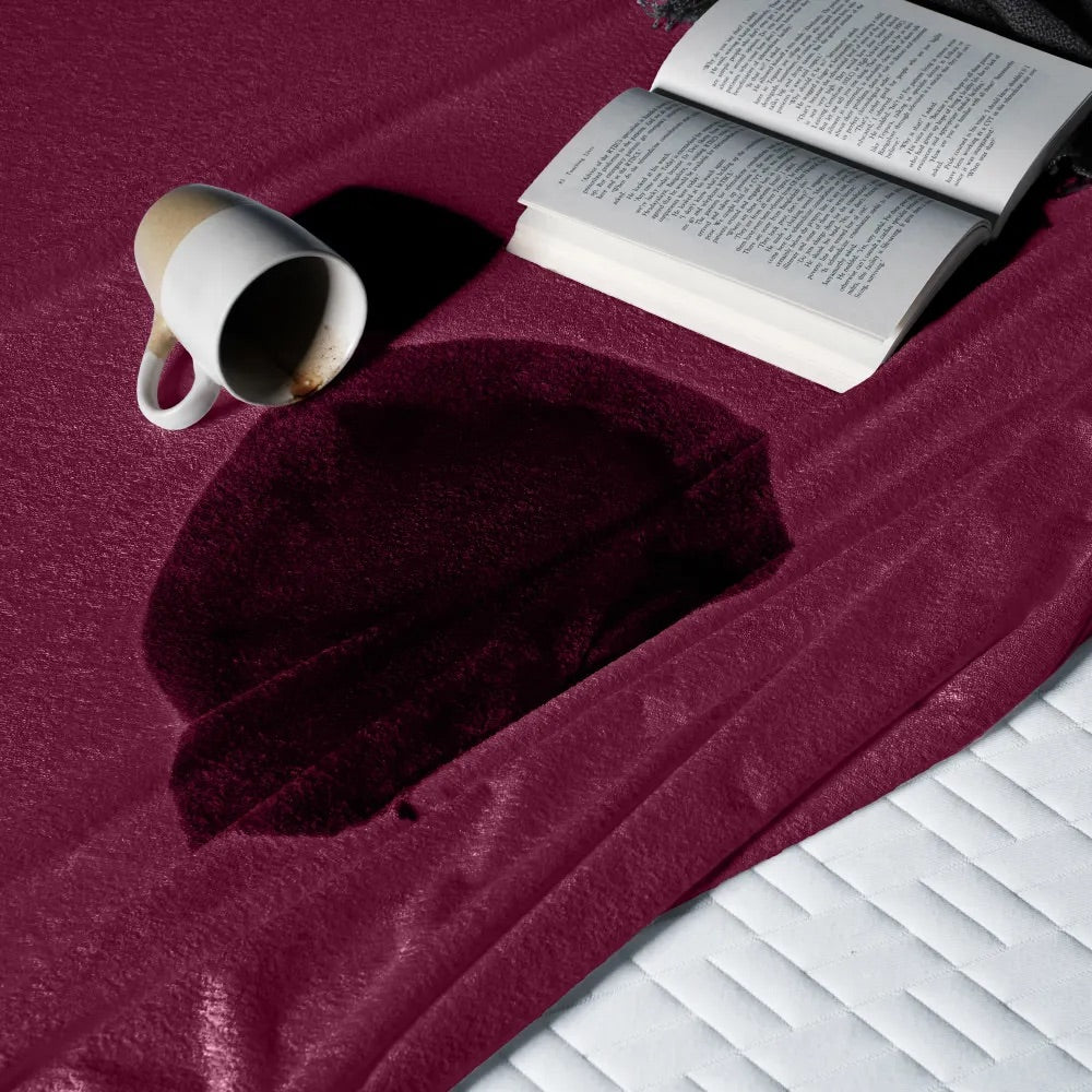 Uchuu's waterproof mattress cover in maroon color.